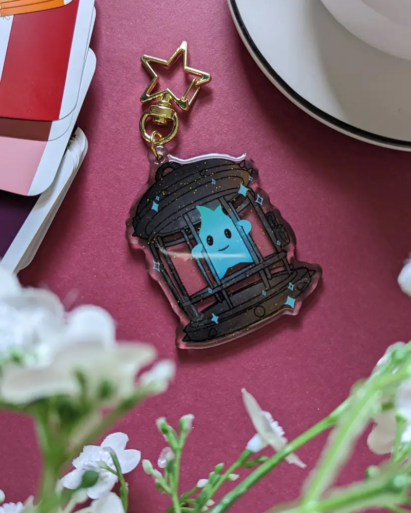 Keychain - Luma en cage